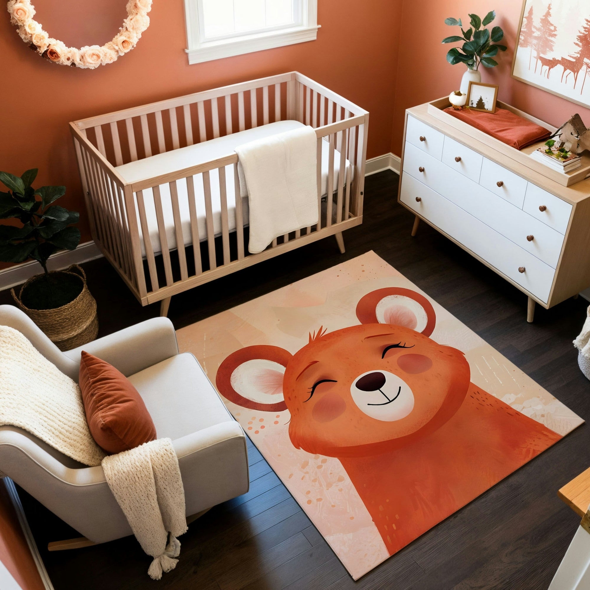 This image showcases a warm and inviting nursery with an earthy orange theme. A light wood crib sits against an orange wall adorned with a floral wreath, paired with a white and wood dresser and a cozy armchair draped in a textured blanket. The standout feature is a playful rug depicting a smiling bear in vibrant orange tones, perfectly complementing the room’s woodland-inspired decor. Natural elements like potted plants and rustic artwork enhance the cozy ambiance.