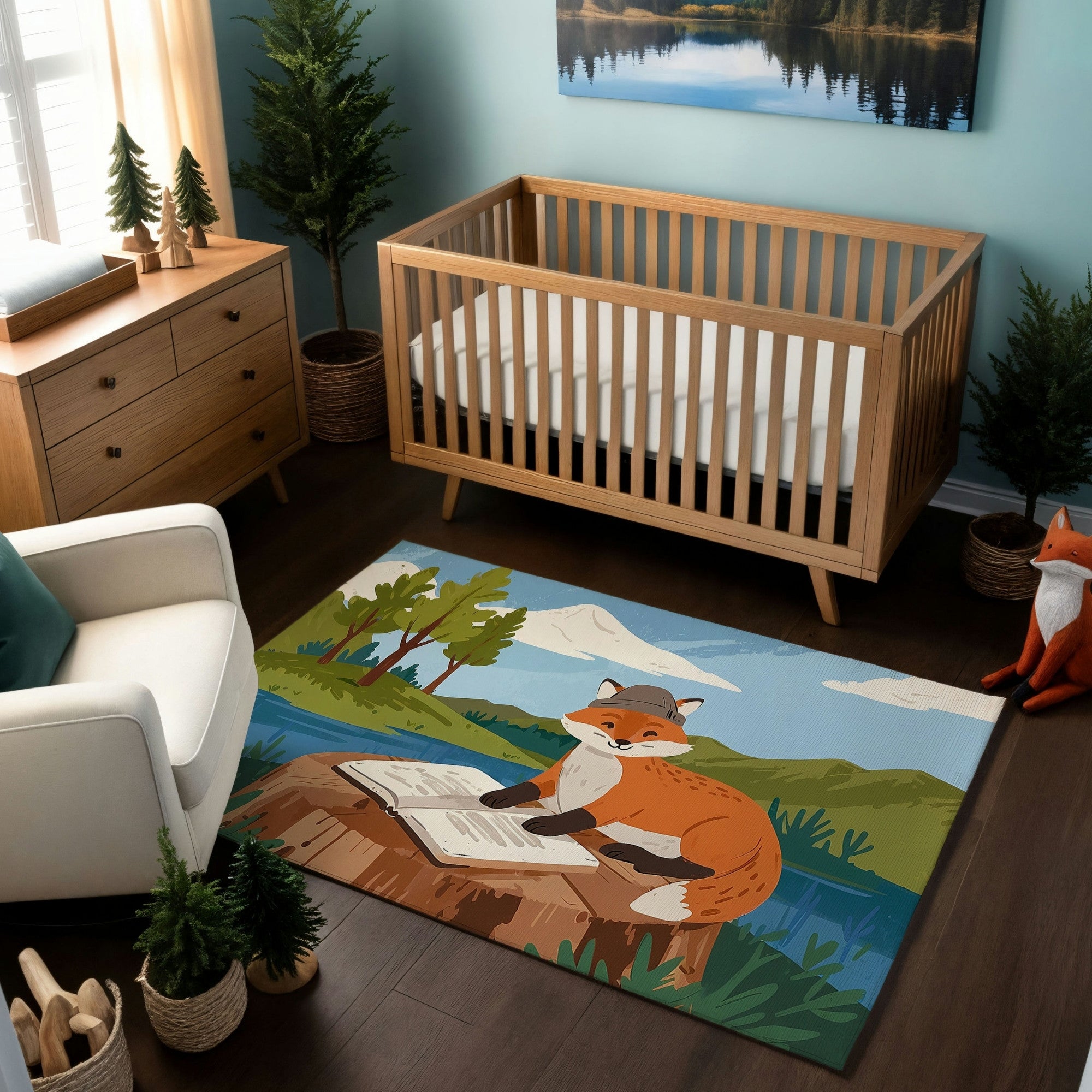 A nature-themed nursery with a light wood crib, a matching dresser, and a white armchair with a green pillow. The decor includes miniature potted pine trees, a fox figurine, and a wall art featuring a serene lake scene. A colorful area rug displays an illustrated fox wearing a cap, sitting on a tree stump and reading a book, with a scenic backdrop of a river, mountains, and trees, adding a whimsical and educational vibe to the space.