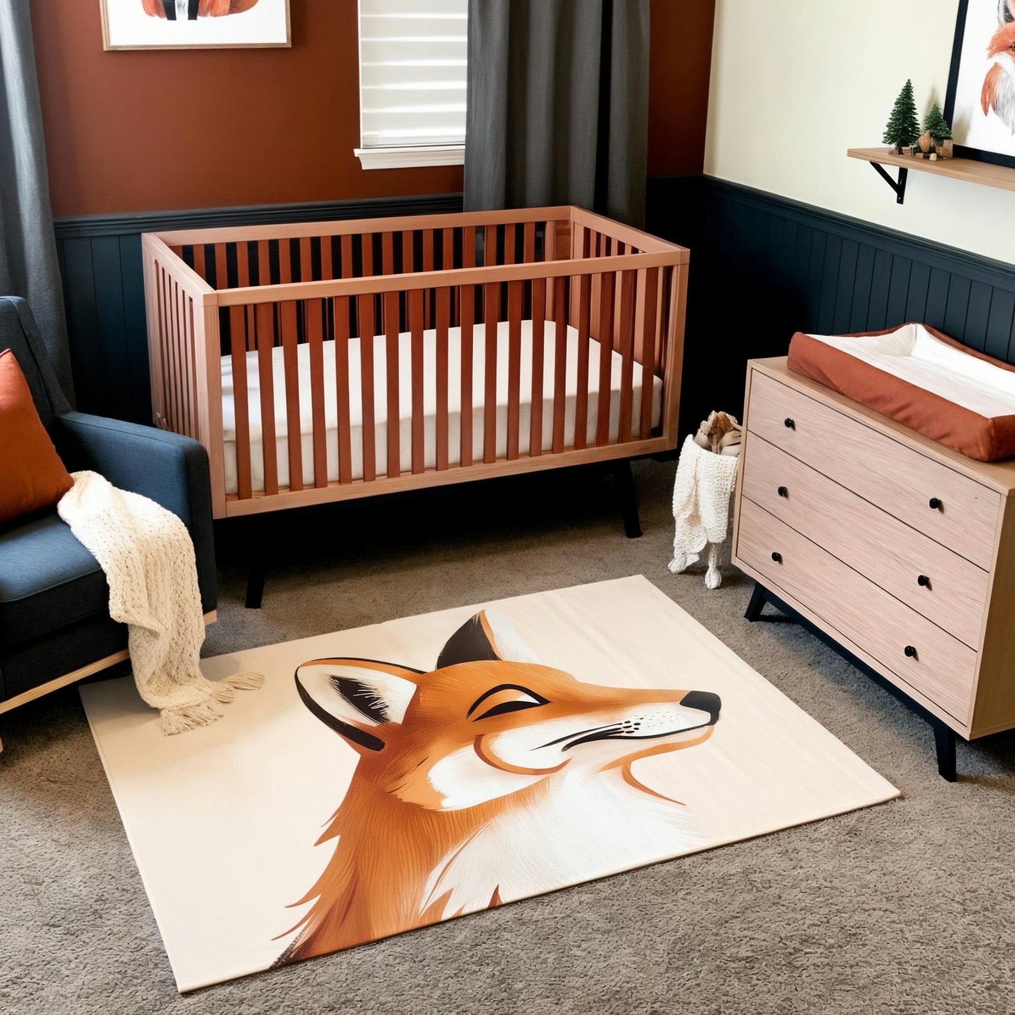 A rustic nursery featuring a wooden crib and a light wood dresser with a rust-colored changing pad, set against a warm two-tone wall with dark wainscoting. The room includes a cozy navy armchair with a rust pillow and a knit blanket, along with an area rug showcasing a detailed illustration of a fox’s profile. Small woodland accents, like miniature trees and a fox plush toy, enhance the charming, nature-inspired atmosphere.