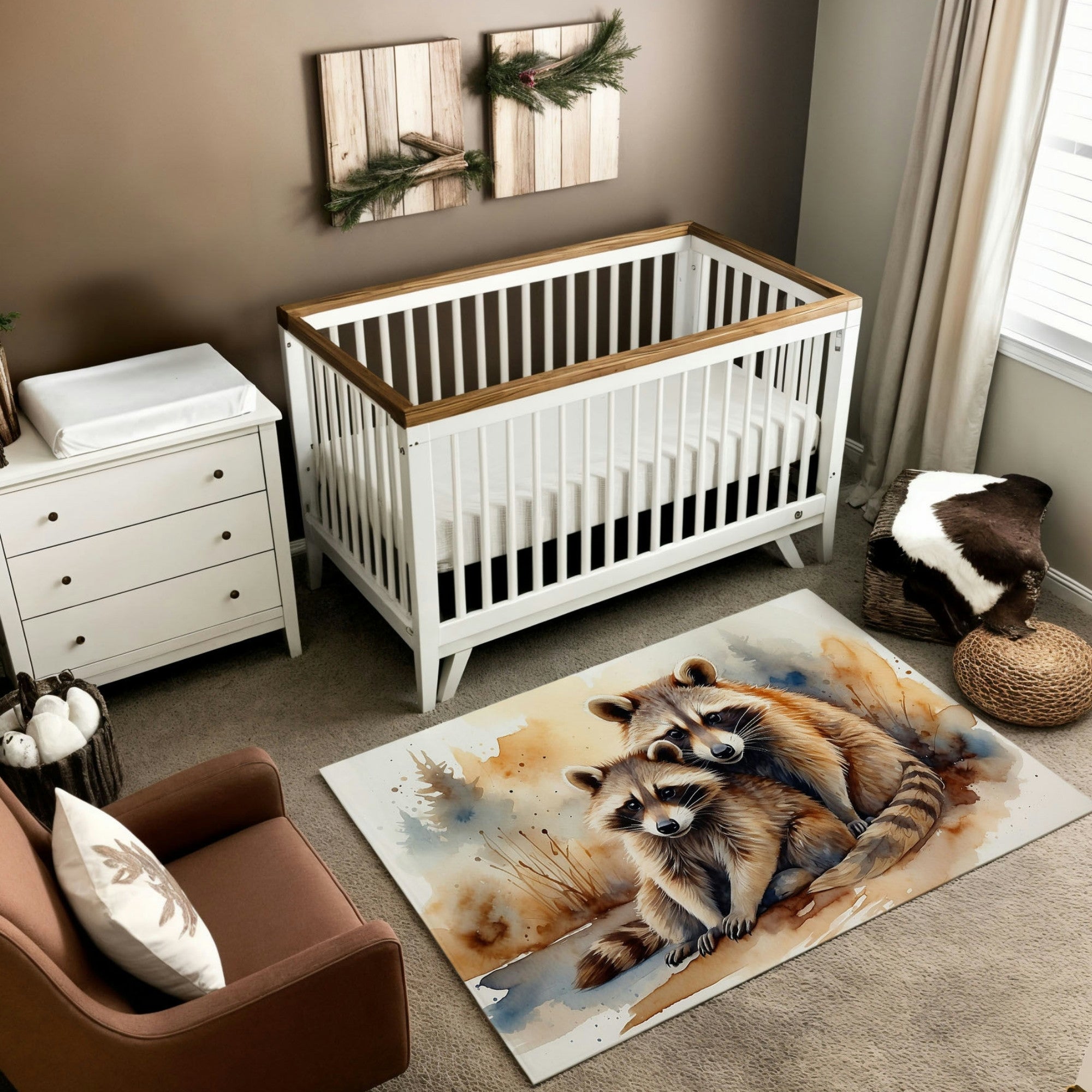 A rustic nursery featuring a white crib with wooden accents, set against a taupe wall with wood plank decorations adorned with greenery. The room includes a white dresser, a brown armchair with a woodland-themed pillow, and a woven basket with a cowhide accent. The centerpiece is a watercolor-style rug illustrating two raccoons sitting together, their detailed fur in warm browns and grays complemented by a soft, textured background of blue and earthy tones.