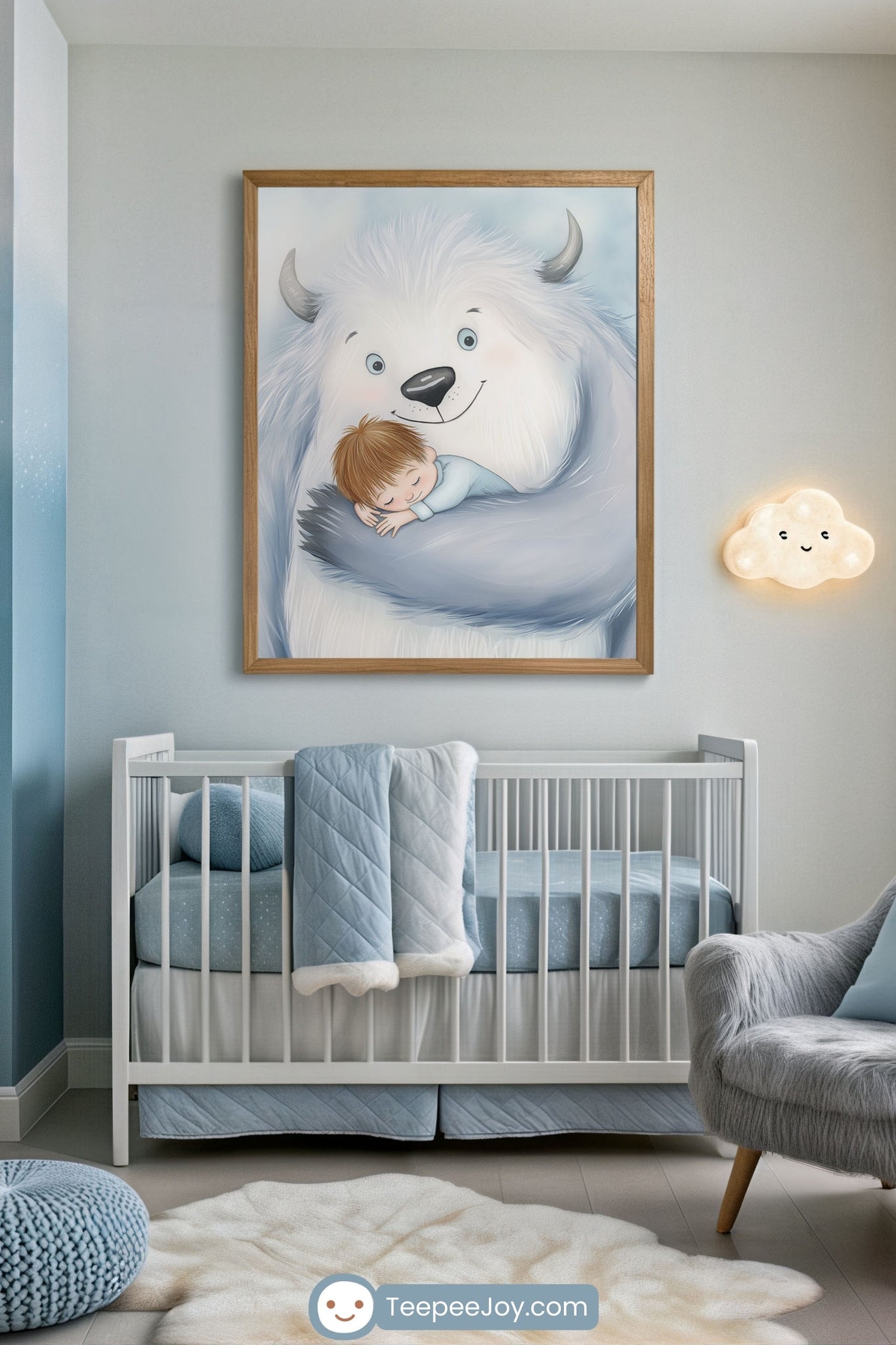 Modern nursery featuring soft blue and gray tones with a framed wall art of a smiling white yeti cuddling a sleeping child. The crib is neatly made with a quilted blue blanket draped over the side, and a plush cloud-shaped night light glows warmly on the wall.