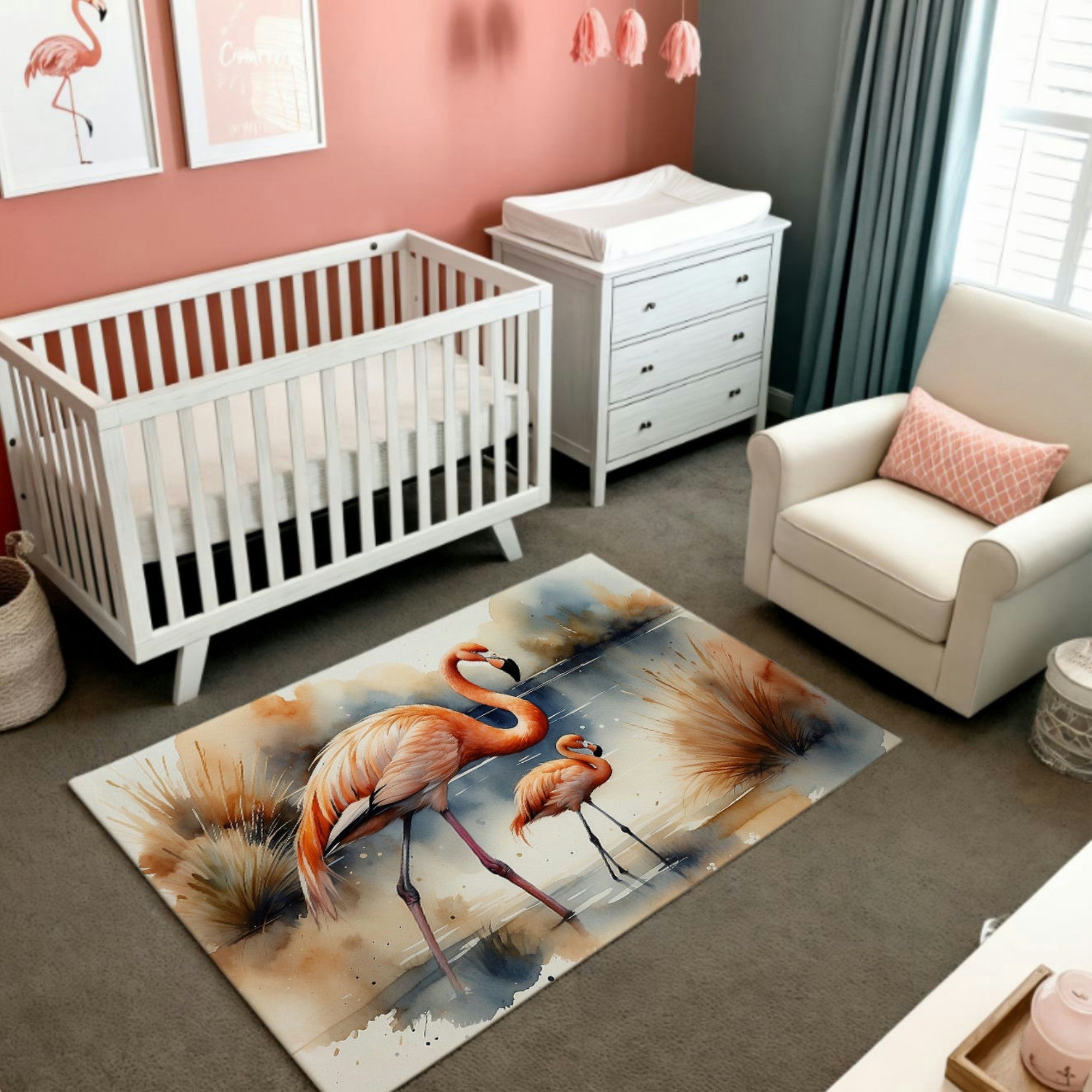 This serene image features a nursery room with soft pink walls and white furniture, complemented by a vibrant area rug showcasing two flamingos in a watercolor design. The flamingos are elegantly depicted in orange and pink tones, standing near a reflective water body surrounded by soft reeds and grasses, creating a tranquil, nature-inspired ambiance. A perfect decor piece for adding warmth and charm to a child’s room.